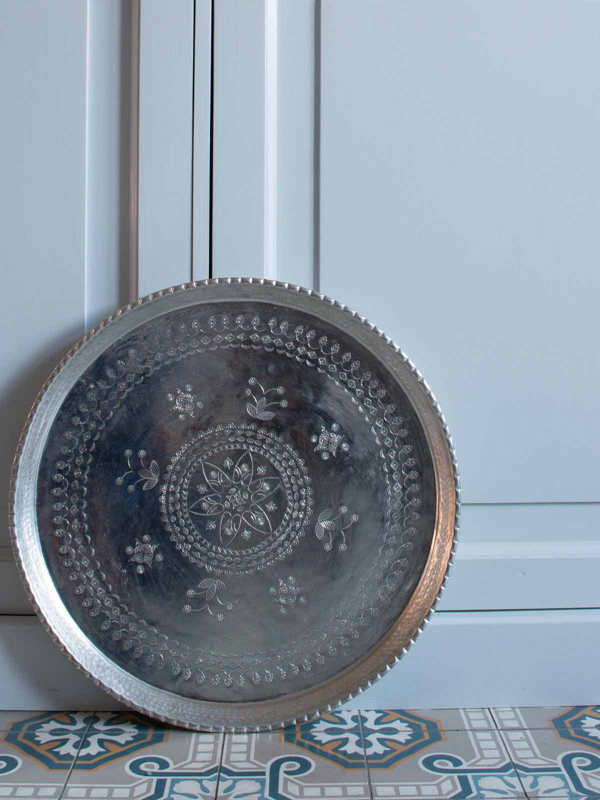 Serving tray stamped and engraved with legs