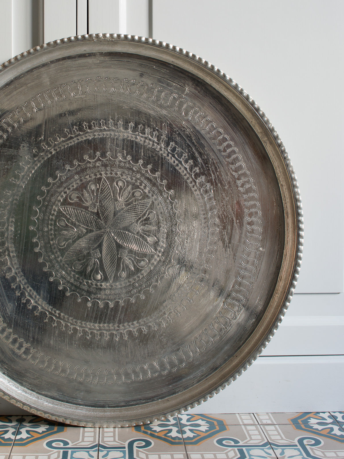 Serving tray stamped and engraved with legs